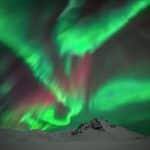 Strong aurora borealis on a guided photo tour in Iceland