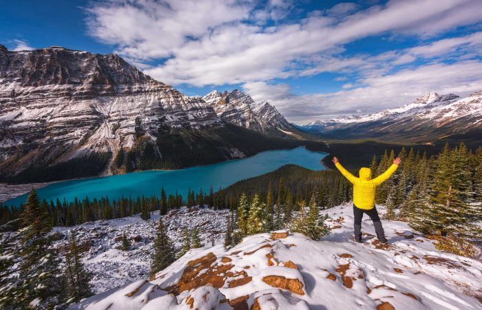 A man in yellow in Peyto Lake in Banff, Canada - workshopsphototours.com